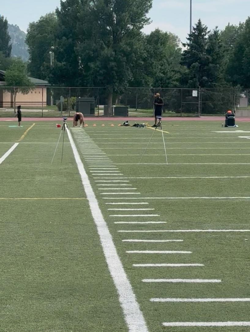 Athlete in a sprint stance at an electronically timed 40-yard dash